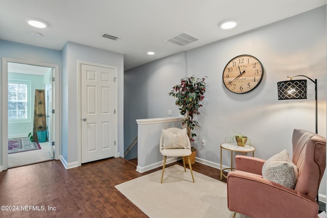 sitting room featuring dark wood-type flooring