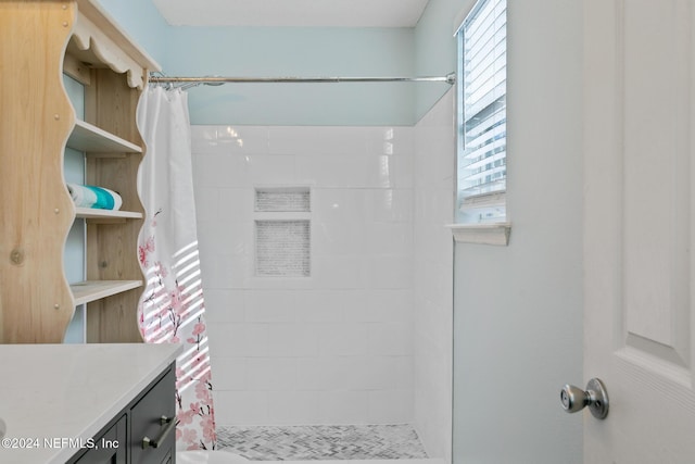 bathroom featuring a shower with curtain, vanity, and toilet