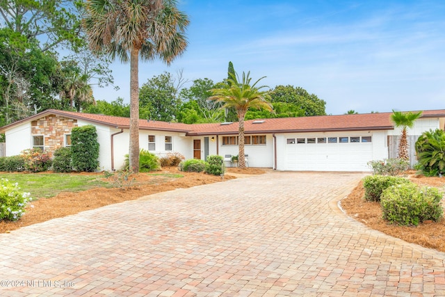 single story home with a garage