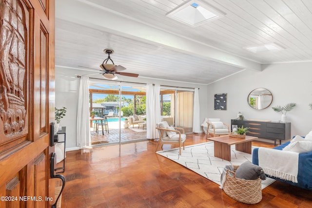 living room featuring hardwood / wood-style floors, ceiling fan, lofted ceiling with beams, and wood ceiling