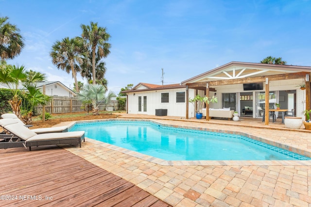 view of swimming pool featuring a deck