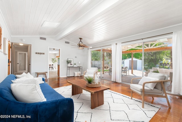 living room with vaulted ceiling with skylight, light hardwood / wood-style flooring, ceiling fan, and wood ceiling