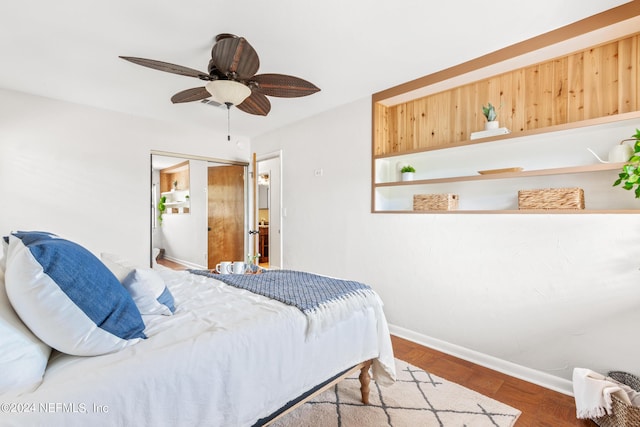 bedroom featuring ceiling fan, dark wood-type flooring, and a closet