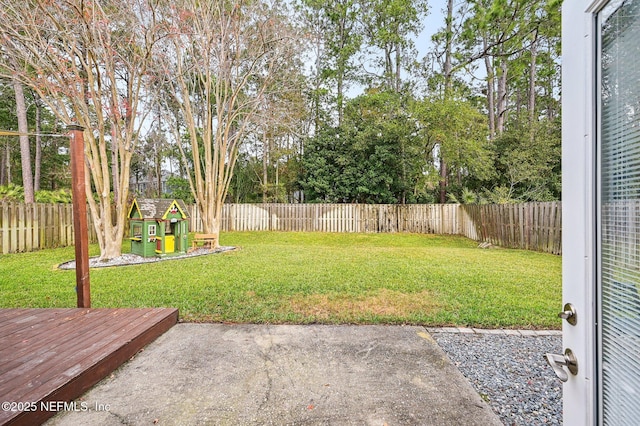 view of yard featuring a patio area and a playground