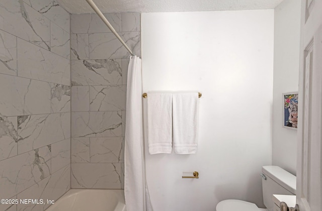 bathroom featuring shower / bathtub combination with curtain and toilet