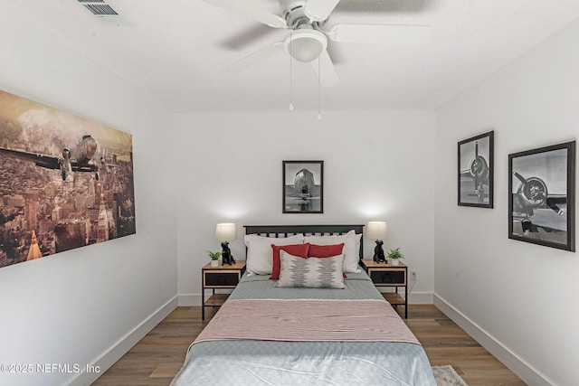 bedroom featuring hardwood / wood-style floors and ceiling fan