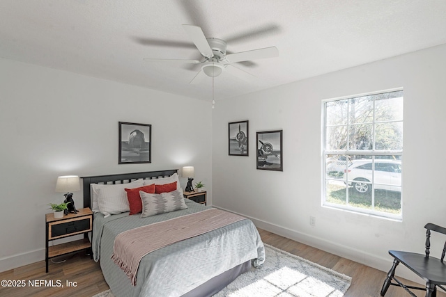 bedroom featuring ceiling fan and hardwood / wood-style flooring