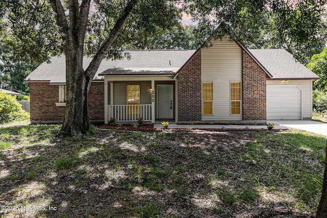 view of front of house with a porch and a garage