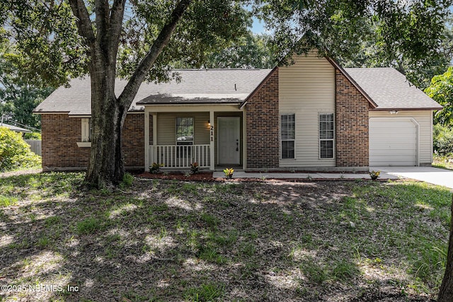 view of front of house with a porch and a garage