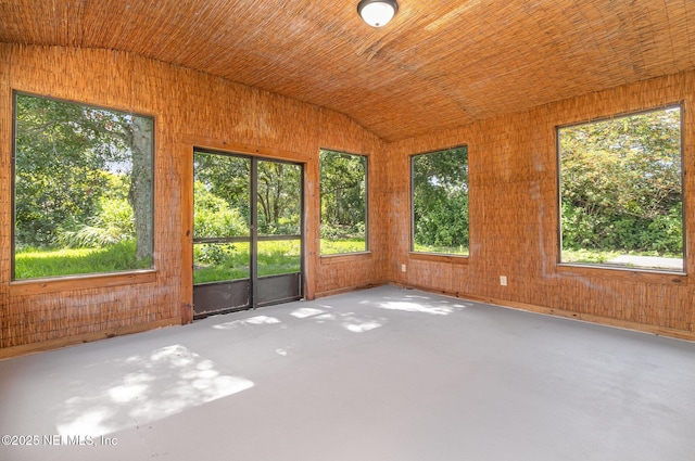 unfurnished sunroom featuring vaulted ceiling and wooden ceiling