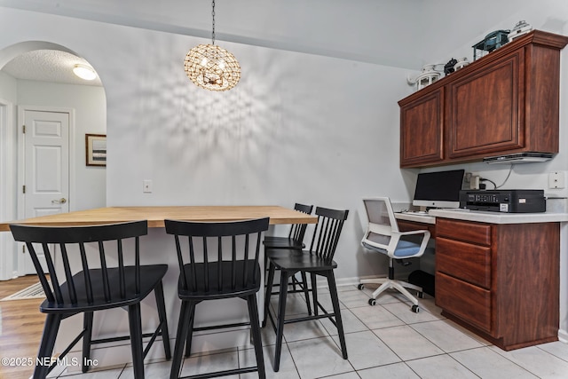 dining area featuring light tile patterned floors