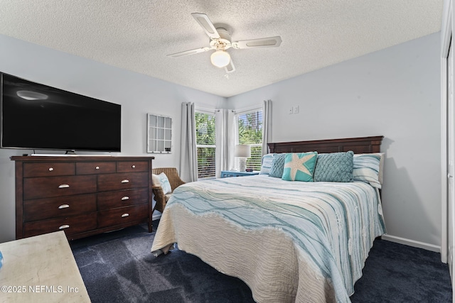 carpeted bedroom with ceiling fan and a textured ceiling