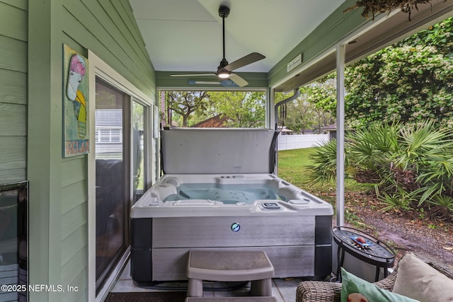 view of patio / terrace featuring ceiling fan and a hot tub