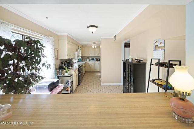 kitchen featuring kitchen peninsula, light tile patterned floors, crown molding, and cream cabinets