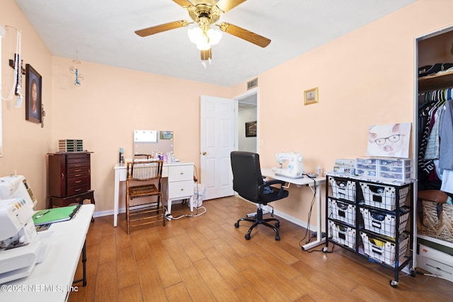 home office with ceiling fan and wood-type flooring