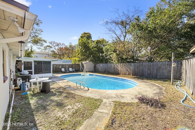 view of swimming pool with a sunroom