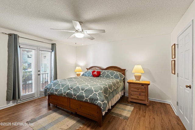 bedroom with access to outside, french doors, ceiling fan, dark hardwood / wood-style floors, and a textured ceiling