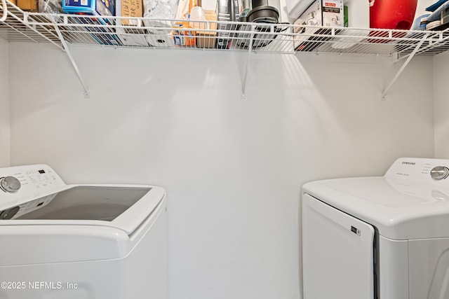 clothes washing area featuring washing machine and dryer