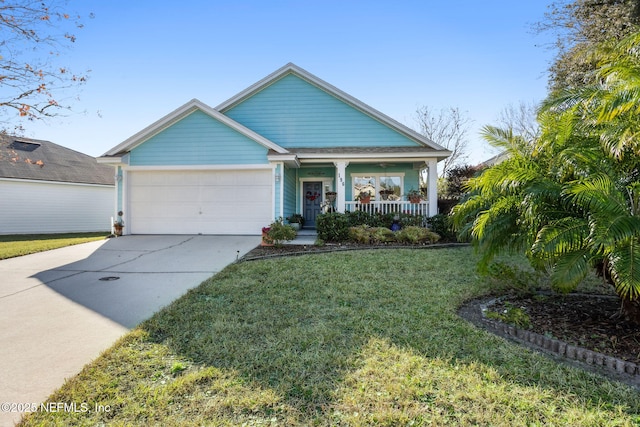 view of front facade with a front lawn, covered porch, and a garage