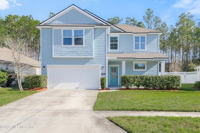 view of front of home with a front yard and a garage