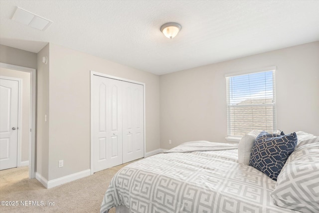 carpeted bedroom with a closet