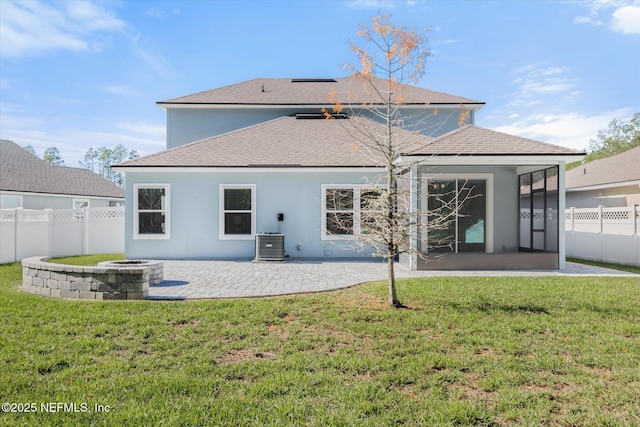 back of house with a patio, a yard, central AC, and a sunroom