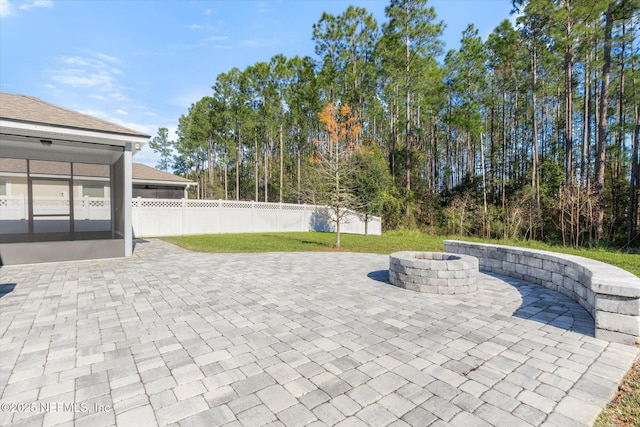 view of patio / terrace with an outdoor fire pit