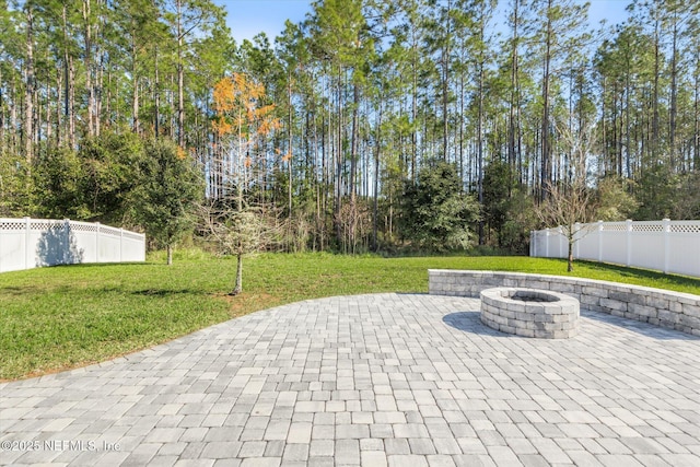 view of patio / terrace with a fire pit