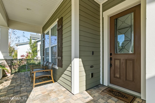 doorway to property featuring a porch