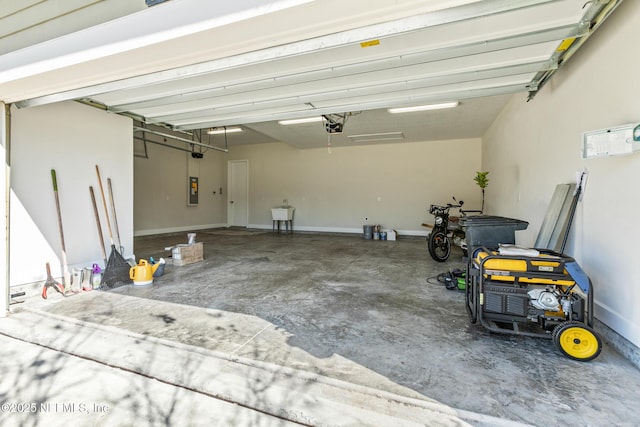 garage featuring a garage door opener and electric panel