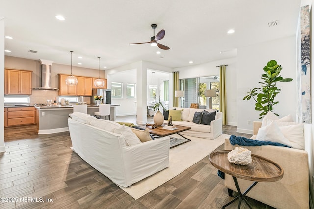 living room featuring ceiling fan