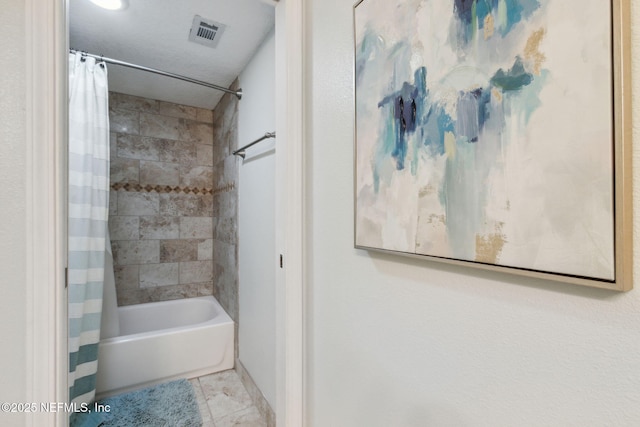 bathroom with tile patterned floors and shower / tub combo with curtain