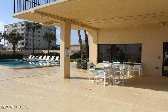 view of patio with a community pool