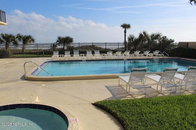 view of swimming pool with a patio area