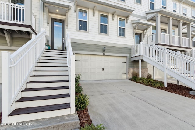 doorway to property with a garage