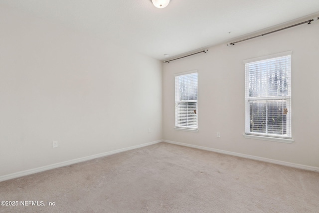 empty room with light colored carpet