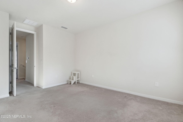 empty room featuring light carpet