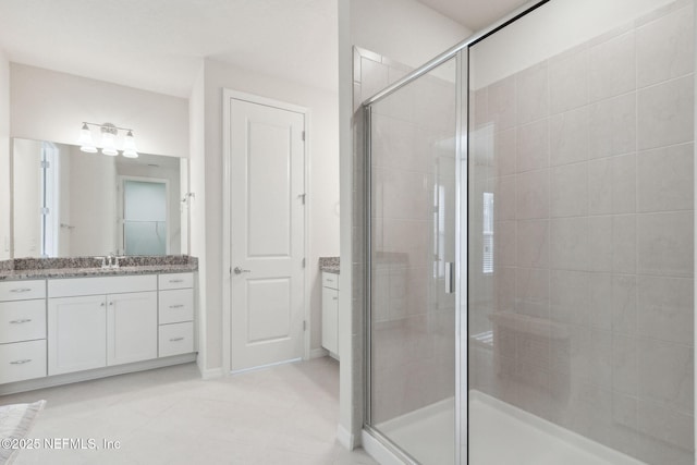 bathroom featuring vanity and walk in shower