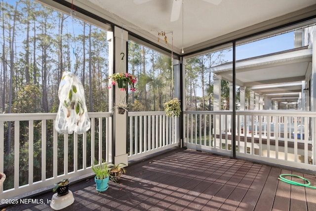 sunroom with ceiling fan and a healthy amount of sunlight