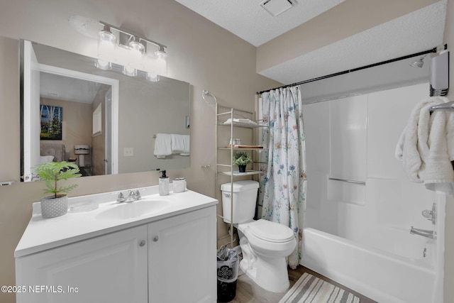 full bathroom with vanity, toilet, shower / bathtub combination with curtain, and a textured ceiling