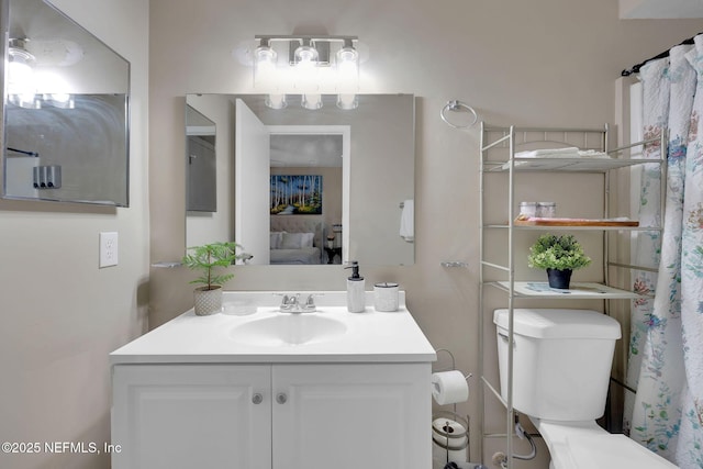 bathroom with vanity and toilet