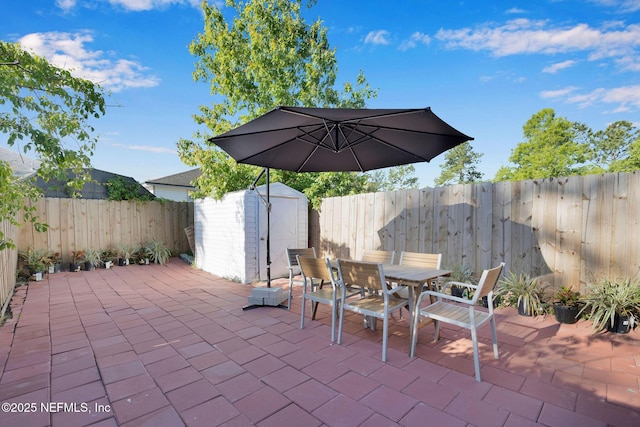 view of patio / terrace featuring a storage unit