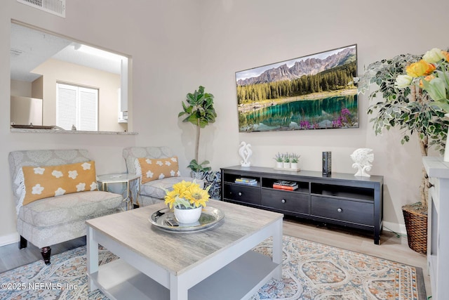 living room with light hardwood / wood-style floors