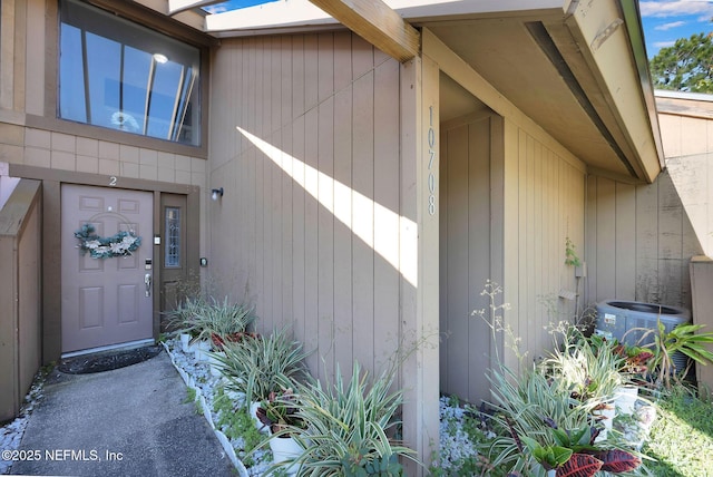 entrance to property featuring central AC unit