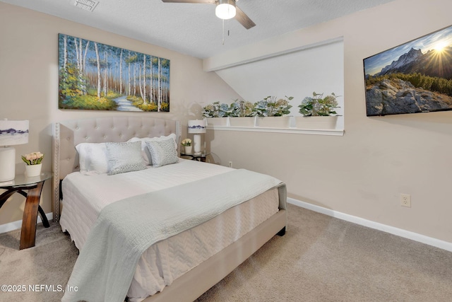 bedroom with carpet flooring, ceiling fan, and vaulted ceiling