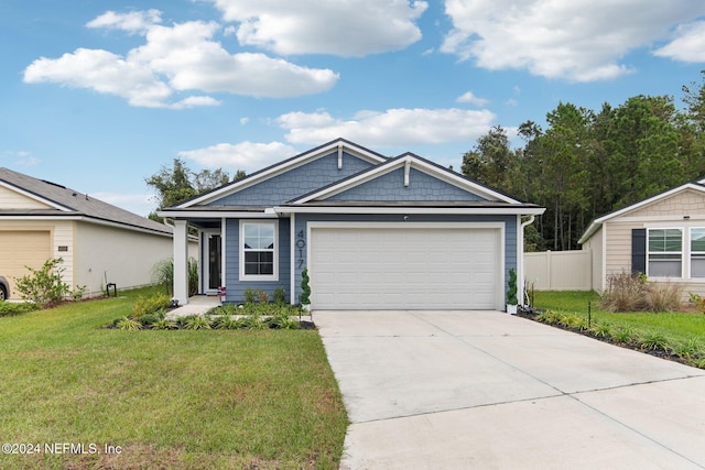 view of front of house with a garage and a front yard