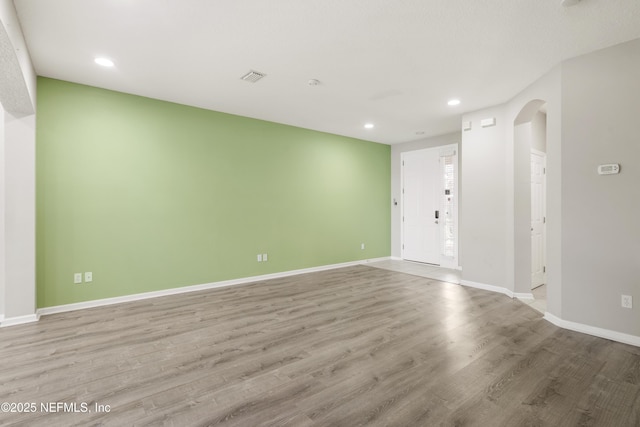 spare room featuring light hardwood / wood-style floors