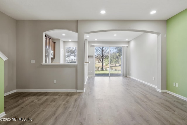 unfurnished living room featuring hardwood / wood-style floors