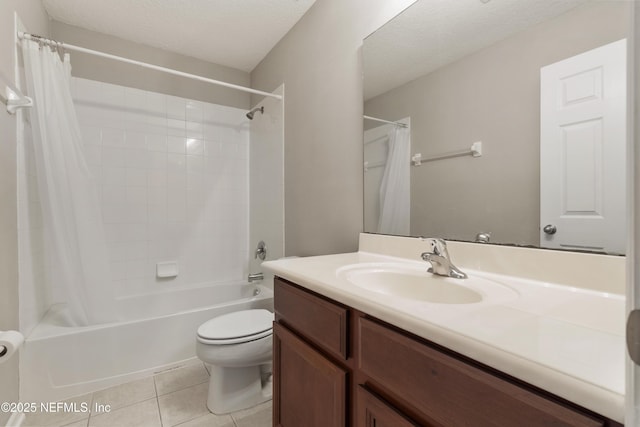 full bathroom featuring shower / bath combo, vanity, tile patterned flooring, toilet, and a textured ceiling