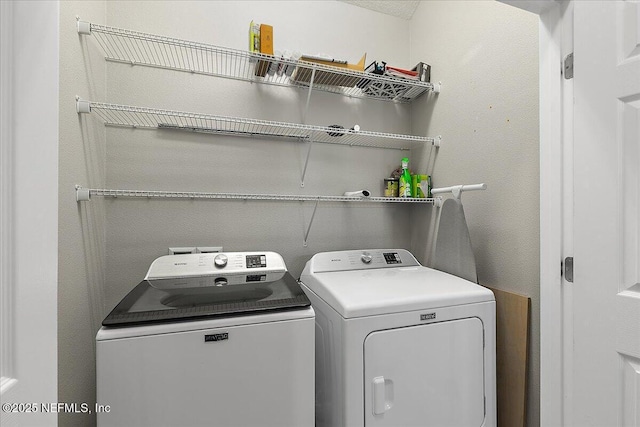 washroom with separate washer and dryer